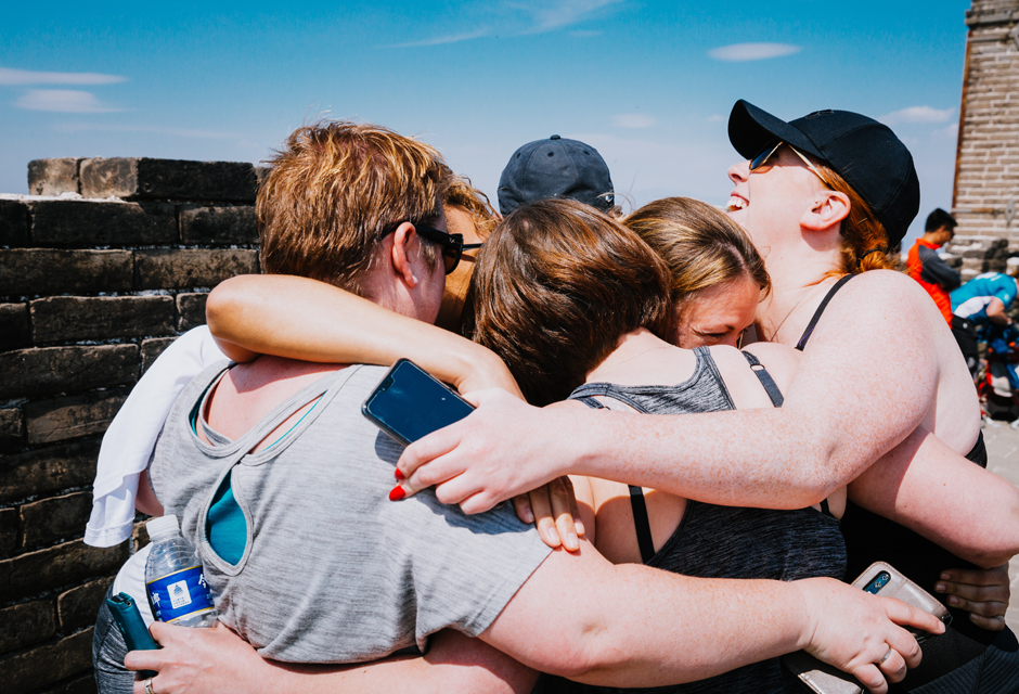 Charity Challenge group hug on Great Wall Discovery Challenge