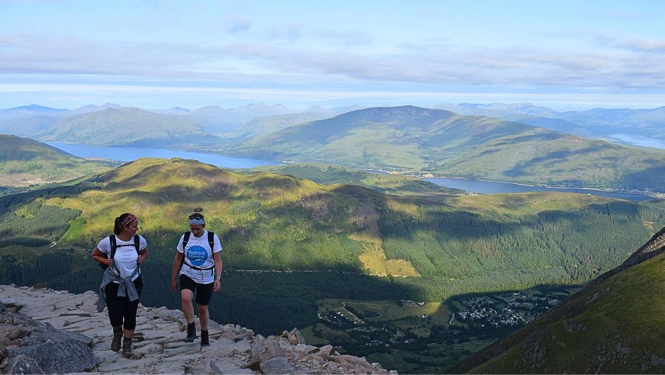 walking and talking on a charity challenge trek